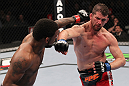 CHICAGO, IL - JANUARY 28:  (L-R) Michael Johnson and Shane Roller trade punches during the UFC on FOX event at United Center on January 28, 2012 in Chicago, Illinois.  (Photo by Nick Laham/Zuffa LLC/Zuffa LLC via Getty Images) *** Local Caption *** Michael Johnson; Shane Roller