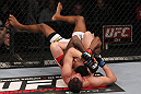CHICAGO, IL - JANUARY 28:  (L-R) Shane Roller attempts a rear choke submission against Michael Johnson during the UFC on FOX event at United Center on January 28, 2012 in Chicago, Illinois.  (Photo by Nick Laham/Zuffa LLC/Zuffa LLC via Getty Images) *** Local Caption *** Michael Johnson; Shane Roller