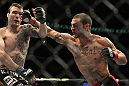 CHICAGO, IL - JANUARY 28:  (L-R) George Roop and Cub Swanson trade punches during the UFC on FOX event at United Center on January 28, 2012 in Chicago, Illinois.  (Photo by Josh Hedges/Zuffa LLC/Zuffa LLC via Getty Images) *** Local Caption *** Cub Swanson; George Roop