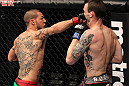 CHICAGO, IL - JANUARY 28:  (L-R) Cub Swanson punches George Roop during the UFC on FOX event at United Center on January 28, 2012 in Chicago, Illinois.  (Photo by Nick Laham/Zuffa LLC/Zuffa LLC via Getty Images) *** Local Caption *** George Roop; Cub Swanson
