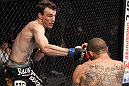 CHICAGO, IL - JANUARY 28:  (L-R) George Roop punches Cub Swanson from the bottom during the UFC on FOX event at United Center on January 28, 2012 in Chicago, Illinois.  (Photo by Nick Laham/Zuffa LLC/Zuffa LLC via Getty Images) *** Local Caption *** Cub Swanson; George Roop