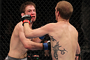 CHICAGO, IL - JANUARY 28:  (L-R) Nik Lentz punches Evan Dunham during the UFC on FOX event at United Center on January 28, 2012 in Chicago, Illinois.  (Photo by Nick Laham/Zuffa LLC/Zuffa LLC via Getty Images) *** Local Caption *** Nik Lentz; Evan Dunham