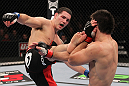 CHICAGO, IL - JANUARY 28:  (L-R) Chris Weidman kicks Demian Maia during the UFC on FOX event at United Center on January 28, 2012 in Chicago, Illinois.  (Photo by Nick Laham/Zuffa LLC/Zuffa LLC via Getty Images) *** Local Caption *** Chris Weidman; Demian Maia