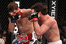 CHICAGO, IL - JANUARY 28:  (R-L) Chael Sonnen punches Michael Bisping during the UFC on FOX event at United Center on January 28, 2012 in Chicago, Illinois.  (Photo by Nick Laham/Zuffa LLC/Zuffa LLC via Getty Images) *** Local Caption *** Chael Sonnen; Michael Bisping