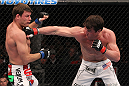 CHICAGO, IL - JANUARY 28:  (R-L) Chael Sonnen punches Michael Bisping during the UFC on FOX event at United Center on January 28, 2012 in Chicago, Illinois.  (Photo by Nick Laham/Zuffa LLC/Zuffa LLC via Getty Images) *** Local Caption *** Chael Sonnen; Michael Bisping