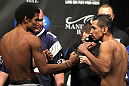 LAS VEGAS, NV - FEBRUARY 03:  (L-R) Bantamweight opponents Alex Caceres and Edwin Figueroa face off after weighing in during the UFC 143 official weigh in at Mandalay Bay Events Center on February 3, 2012 in Las Vegas, Nevada.  (Photo by Josh Hedges/Zuffa LLC/Zuffa LLC via Getty Images) *** Local Caption *** Alex Caceres; Edwin Figueroa