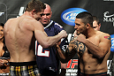 LAS VEGAS, NV - FEBRUARY 03:  (L-R) Welterweight opponents Matthew Riddle and Henry Martinez face off after weighing in during the UFC 143 official weigh in at Mandalay Bay Events Center on February 3, 2012 in Las Vegas, Nevada.|2:55:8  (Photo by Josh Hedges/Zuffa LLC/Zuffa LLC via Getty Images) *** Local Caption *** Matthew Riddle; Henry Martinez