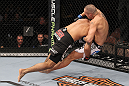 LAS VEGAS, NV - FEBRUARY 04:  Rafael Natal (black shorts) takes Michael Kuiper down to the canvas during the UFC 143 event at Mandalay Bay Events Center on February 4, 2012 in Las Vegas, Nevada.  (Photo by Nick Laham/Zuffa LLC/Zuffa LLC via Getty Images) *** Local Caption *** Rafael Natal; Michael Kuiper