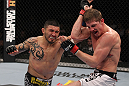 LAS VEGAS, NV - FEBRUARY 04:  (R-L) Henry Martinez punches Matt Riddle during the UFC 143 event at Mandalay Bay Events Center on February 4, 2012 in Las Vegas, Nevada.  (Photo by Nick Laham/Zuffa LLC/Zuffa LLC via Getty Images) *** Local Caption *** Henry Martinez; Matt Riddle