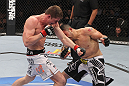 LAS VEGAS, NV - FEBRUARY 04:  (L-R) Matt Riddle and Henry Martinez exchange punches during the UFC 143 event at Mandalay Bay Events Center on February 4, 2012 in Las Vegas, Nevada.  (Photo by Nick Laham/Zuffa LLC/Zuffa LLC via Getty Images) *** Local Caption *** Matt Riddle; Henry Martinez