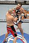 LAS VEGAS, NV - FEBRUARY 04:  Matt Brown (white shorts) and Chris Cope (red/black shorts) exchange punches during the UFC 143 event at Mandalay Bay Events Center on February 4, 2012 in Las Vegas, Nevada.  (Photo by Josh Hedges/Zuffa LLC/Zuffa LLC via Getty Images) *** Local Caption *** Matt Brown; Chris Cope