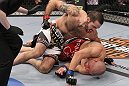 LAS VEGAS, NV - FEBRUARY 04:  Matt Brown (white shorts) attempts to finish Chris Cope during the UFC 143 event at Mandalay Bay Events Center on February 4, 2012 in Las Vegas, Nevada.  (Photo by Nick Laham/Zuffa LLC/Zuffa LLC via Getty Images) *** Local Caption *** Chris Cope; Matt Brown
