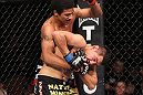 LAS VEGAS, NV - FEBRUARY 04:  Alex Caceres (top) delivers punches to Edwin Figueora during the UFC 143 event at Mandalay Bay Events Center on February 4, 2012 in Las Vegas, Nevada.  (Photo by Nick Laham/Zuffa LLC/Zuffa LLC via Getty Images) *** Local Caption *** Alex Caceres; Edwin Figueroa