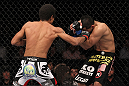 LAS VEGAS, NV - FEBRUARY 04:  Alex Caceres (left) punches Edwin Figueroa during the UFC 143 event at Mandalay Bay Events Center on February 4, 2012 in Las Vegas, Nevada.  (Photo by Nick Laham/Zuffa LLC/Zuffa LLC via Getty Images) *** Local Caption *** Alex Caceres; Edwin Figueroa