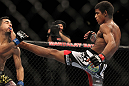 LAS VEGAS, NV - FEBRUARY 04:  Alex Caceres (right) kicks Edwin Figueroa during the UFC 143 event at Mandalay Bay Events Center on February 4, 2012 in Las Vegas, Nevada.  (Photo by Josh Hedges/Zuffa LLC/Zuffa LLC via Getty Images) *** Local Caption *** Alex Caceres; Edwin Figueroa