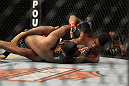 LAS VEGAS, NV - FEBRUARY 04:  Alex Caceres (right) throws punches at Edwin Figueroa on the ground during the UFC 143 event at Mandalay Bay Events Center on February 4, 2012 in Las Vegas, Nevada.  (Photo by Josh Hedges/Zuffa LLC/Zuffa LLC via Getty Images) *** Local Caption *** Alex Caceres; Edwin Figueroa