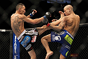 LAS VEGAS, NV - FEBRUARY 04:  Max Holloway (left) kicks Dustin Poirier during the UFC 143 event at Mandalay Bay Events Center on February 4, 2012 in Las Vegas, Nevada.  (Photo by Josh Hedges/Zuffa LLC/Zuffa LLC via Getty Images) *** Local Caption *** Max Holloway; Dustin Poirier