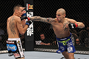 LAS VEGAS, NV - FEBRUARY 04:  Dustin Poirier (right) punches Max Holloway during the UFC 143 event at Mandalay Bay Events Center on February 4, 2012 in Las Vegas, Nevada.  (Photo by Nick Laham/Zuffa LLC/Zuffa LLC via Getty Images) *** Local Caption *** Dustin Poirier; Max Holloway