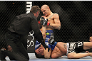 LAS VEGAS, NV - FEBRUARY 04:  Dustin Poirier (blue shorts) attempts to submit Max Holloway during the UFC 143 event at Mandalay Bay Events Center on February 4, 2012 in Las Vegas, Nevada.  (Photo by Josh Hedges/Zuffa LLC/Zuffa LLC via Getty Images) *** Local Caption *** Dustin Poirier