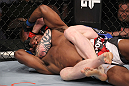 LAS VEGAS, NV - FEBRUARY 04:  Ed Herman attempts to submit Clifford Starks (red/white/black shorts) during the UFC 143 event at Mandalay Bay Events Center on February 4, 2012 in Las Vegas, Nevada.  (Photo by Nick Laham/Zuffa LLC/Zuffa LLC via Getty Images) *** Local Caption *** Ed Herman; Clifford Starks