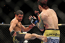 LAS VEGAS, NV - FEBRUARY 04:  Renan Barao (left) kicks Scott Jorgensen during the UFC 143 event at Mandalay Bay Events Center on February 4, 2012 in Las Vegas, Nevada.  (Photo by Josh Hedges/Zuffa LLC/Zuffa LLC via Getty Images) *** Local Caption *** Renan Barao; Scott Jorgensen