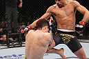 LAS VEGAS, NV - FEBRUARY 04:  Renan Barao (right) knees Scott Jorgensen during the UFC 143 event at Mandalay Bay Events Center on February 4, 2012 in Las Vegas, Nevada.  (Photo by Nick Laham/Zuffa LLC/Zuffa LLC via Getty Images) *** Local Caption *** Renan Barao; Scott Jorgensen