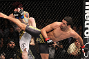 LAS VEGAS, NV - FEBRUARY 04:  Renan Barao (right) delivers a roundhouse kick to Scott Jorgensen during the UFC 143 event at Mandalay Bay Events Center on February 4, 2012 in Las Vegas, Nevada.  (Photo by Nick Laham/Zuffa LLC/Zuffa LLC via Getty Images) *** Local Caption *** Renan Barao; Scott Jorgensen