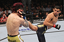 LAS VEGAS, NV - FEBRUARY 04:  Renan Barao (right) kicks Scott Jorgensen during the UFC 143 event at Mandalay Bay Events Center on February 4, 2012 in Las Vegas, Nevada.  (Photo by Nick Laham/Zuffa LLC/Zuffa LLC via Getty Images) *** Local Caption *** Renan Barao; Scott Jorgensen