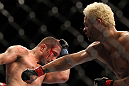 LAS VEGAS, NV - FEBRUARY 04:  Josh Koscheck (right) punches Mike Pierce during the UFC 143 event at Mandalay Bay Events Center on February 4, 2012 in Las Vegas, Nevada.  (Photo by Josh Hedges/Zuffa LLC/Zuffa LLC via Getty Images) *** Local Caption *** Josh Koscheck; Mike Pierce