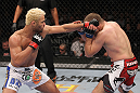 LAS VEGAS, NV - FEBRUARY 04:  Josh Koscheck (left) punches Mike Pierce during the UFC 143 event at Mandalay Bay Events Center on February 4, 2012 in Las Vegas, Nevada.  (Photo by Nick Laham/Zuffa LLC/Zuffa LLC via Getty Images) *** Local Caption *** Josh Koscheck; Mike Pierce
