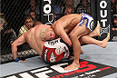 LAS VEGAS, NV - FEBRUARY 04:  Josh Koscheck (right) wrestles Mike Pierce to the ground during the UFC 143 event at Mandalay Bay Events Center on February 4, 2012 in Las Vegas, Nevada.  (Photo by Nick Laham/Zuffa LLC/Zuffa LLC via Getty Images) *** Local Caption *** Josh Koscheck