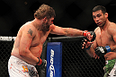 LAS VEGAS, NV - FEBRUARY 04:  Roy Nelson (left) punches Fabricio Werdum during the UFC 143 event at Mandalay Bay Events Center on February 4, 2012 in Las Vegas, Nevada.  (Photo by Josh Hedges/Zuffa LLC/Zuffa LLC via Getty Images) *** Local Caption *** Roy Nelson; Fabricio Werdum