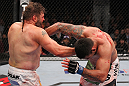 LAS VEGAS, NV - FEBRUARY 04:  (L-R) Roy Nelson punches Fabricio Werdum during the UFC 143 event at Mandalay Bay Events Center on February 4, 2012 in Las Vegas, Nevada.  (Photo by Nick Laham/Zuffa LLC/Zuffa LLC via Getty Images) *** Local Caption *** Roy Nelson; Fabricio Werdum