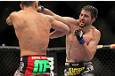 LAS VEGAS - FEBRUARY 04:  Carlos Condit (right) punches Nick Diaz during the UFC 143 event at Mandalay Bay Events Center on February 4, 2012 in Las Vegas, Nevada.  (Photo by Josh Hedges/Zuffa LLC/Zuffa LLC via Getty Images) *** Local Caption *** Carlos Condit; Nick Diaz