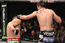 LAS VEGAS - FEBRUARY 04:  Carlos Condit (right) punches Nick Diaz during the UFC 143 event at Mandalay Bay Events Center on February 4, 2012 in Las Vegas, Nevada.  (Photo by Nick Laham/Zuffa LLC/Zuffa LLC via Getty Images) *** Local Caption *** Carlos Condit; Nick Diaz