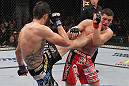 LAS VEGAS - FEBRUARY 04:  Carlos Condit (left) kicks Nick Diaz during the UFC 143 event at Mandalay Bay Events Center on February 4, 2012 in Las Vegas, Nevada.  (Photo by Nick Laham/Zuffa LLC/Zuffa LLC via Getty Images) *** Local Caption *** Carlos Condit; Nick Diaz