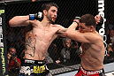LAS VEGAS - FEBRUARY 04:  Carlos Condit (left) punches Nick Diaz during the UFC 143 event at Mandalay Bay Events Center on February 4, 2012 in Las Vegas, Nevada.  (Photo by Nick Laham/Zuffa LLC/Zuffa LLC via Getty Images) *** Local Caption *** Carlos Condit; Nick Diaz