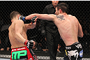 LAS VEGAS - FEBRUARY 04:  Carlos Condit (right) punches Nick Diaz during the UFC 143 event at Mandalay Bay Events Center on February 4, 2012 in Las Vegas, Nevada.  (Photo by Nick Laham/Zuffa LLC/Zuffa LLC via Getty Images) *** Local Caption *** Carlos Condit; Nick Diaz