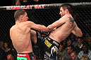 LAS VEGAS - FEBRUARY 04:  Carlos Condit (right) hits Nick Diaz with a knee during the UFC 143 event at Mandalay Bay Events Center on February 4, 2012 in Las Vegas, Nevada.  (Photo by Nick Laham/Zuffa LLC/Zuffa LLC via Getty Images) *** Local Caption *** Nick Diaz; Carlos Condit