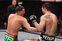 LAS VEGAS - FEBRUARY 04:  Nick Diaz (left) punches Carlos Condit during the UFC 143 event at Mandalay Bay Events Center on February 4, 2012 in Las Vegas, Nevada.  (Photo by Nick Laham/Zuffa LLC/Zuffa LLC via Getty Images) *** Local Caption *** Nick Diaz; Carlos Condit