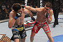 LAS VEGAS - FEBRUARY 04:  (R-L) Nick Diaz punches Carlos Condit during the UFC 143 event at Mandalay Bay Events Center on February 4, 2012 in Las Vegas, Nevada.  (Photo by Nick Laham/Zuffa LLC/Zuffa LLC via Getty Images) *** Local Caption *** Carlos Condit; Nick Diaz