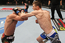 OMAHA, NE - FEBRUARY 15:  (R-L) Tim Means punches Bernardo Magalhaes during the UFC on FUEL TV event at Omaha Civic Auditorium on February 15, 2012 in Omaha, Nebraska.  (Photo by Josh Hedges/Zuffa LLC/Zuffa LLC via Getty Images) *** Local Caption *** Tim Means; Bernardo Magalhaes