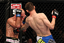 OMAHA, NE - FEBRUARY 15:  (R-L) Tim Means punches Bernardo Magalhaes during the UFC on FUEL TV event at Omaha Civic Auditorium on February 15, 2012 in Omaha, Nebraska.  (Photo by Josh Hedges/Zuffa LLC/Zuffa LLC via Getty Images) *** Local Caption *** Tim Means; Bernardo Magalhaes
