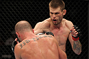 OMAHA, NE - FEBRUARY 15:  (R-L) Tim Means punches Bernardo Magalhaes during the UFC on FUEL TV event at Omaha Civic Auditorium on February 15, 2012 in Omaha, Nebraska.  (Photo by Josh Hedges/Zuffa LLC/Zuffa LLC via Getty Images) *** Local Caption *** Tim Means; Bernardo Magalhaes