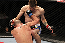 OMAHA, NE - FEBRUARY 15:  (L-R) Bernardo Magalhaes and Tim Means trade strikes during the UFC on FUEL TV event at Omaha Civic Auditorium on February 15, 2012 in Omaha, Nebraska.  (Photo by Josh Hedges/Zuffa LLC/Zuffa LLC via Getty Images) *** Local Caption *** Tim Means; Bernardo Magalhaes