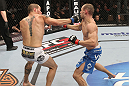 OMAHA, NE - FEBRUARY 15:  (L-R) Justin Salas punches Anton Kuivanen during the UFC on FUEL TV event at Omaha Civic Auditorium on February 15, 2012 in Omaha, Nebraska.  (Photo by Josh Hedges/Zuffa LLC/Zuffa LLC via Getty Images) *** Local Caption *** Anton Kuivanen; Justin Salas