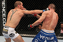 OMAHA, NE - FEBRUARY 15:  (L-R) Justin Salas punches Anton Kuivanen during the UFC on FUEL TV event at Omaha Civic Auditorium on February 15, 2012 in Omaha, Nebraska.  (Photo by Josh Hedges/Zuffa LLC/Zuffa LLC via Getty Images) *** Local Caption *** Anton Kuivanen; Justin Salas