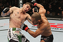 OMAHA, NE - FEBRUARY 15:  (L-R) John Albert and Ivan Menjivar trade punches during the UFC on FUEL TV event at Omaha Civic Auditorium on February 15, 2012 in Omaha, Nebraska.  (Photo by Josh Hedges/Zuffa LLC/Zuffa LLC via Getty Images) *** Local Caption *** Ivan Menjivar; John Albert