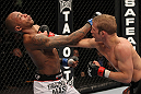 OMAHA, NE - FEBRUARY 15:  (R-L) TJ Dillashaw punches Walel Watson during the UFC on FUEL TV event at Omaha Civic Auditorium on February 15, 2012 in Omaha, Nebraska.  (Photo by Josh Hedges/Zuffa LLC/Zuffa LLC via Getty Images) *** Local Caption *** TJ Dillashaw; Walel Watson