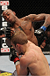 OMAHA, NE - FEBRUARY 15:  (R-L) TJ Dillashaw punches Walel Watson during the UFC on FUEL TV event at Omaha Civic Auditorium on February 15, 2012 in Omaha, Nebraska.  (Photo by Josh Hedges/Zuffa LLC/Zuffa LLC via Getty Images) *** Local Caption *** TJ Dillashaw; Walel Watson